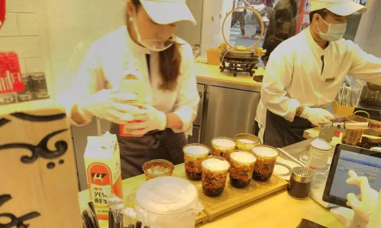 Workers prepare Xing Fu Tang Milk Tea