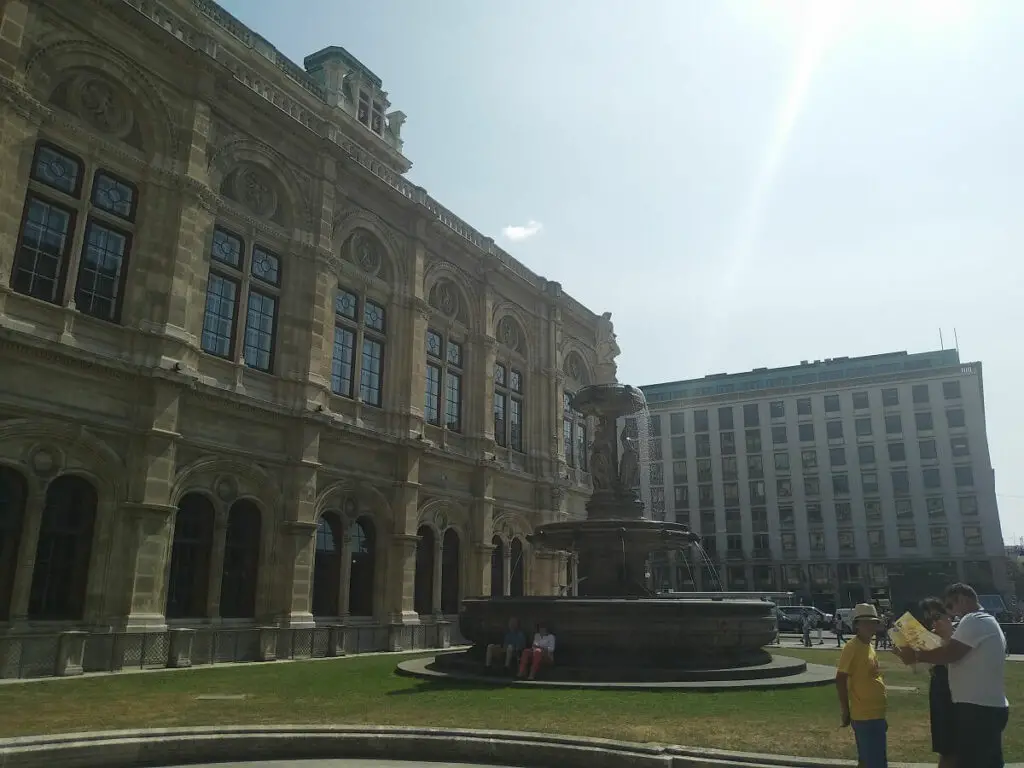 A large fountain outside of the Vienna State Opera